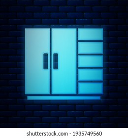 Glowing neon Wardrobe icon isolated on brick wall background.  Vector