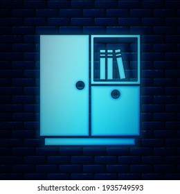 Glowing neon Wardrobe icon isolated on brick wall background.  Vector