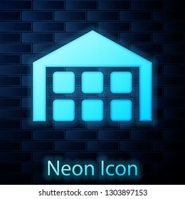 Glowing neon Warehouse icon isolated on brick wall background. Vector Illustration