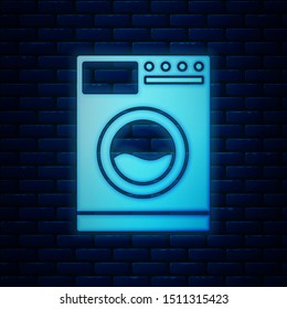 Glowing neon Washer icon isolated on brick wall background. Washing machine icon. Clothes washer - laundry machine. Home appliance symbol.  Vector Illustration
