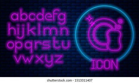 Glowing neon Washing dishes icon isolated on brick wall background. Plate and sponge. Cleaning dishes icon. Dishwasher sign. Clean tableware sign. Neon light alphabet. Vector Illustration