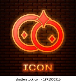 Glowing neon Washing dishes icon isolated on brick wall background. Cleaning dishes icon. Dishwasher sign. Clean tableware sign.  Vector Illustration