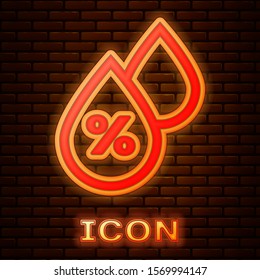 Glowing neon Water drop percentage icon isolated on brick wall background. Humidity analysis.  Vector Illustration