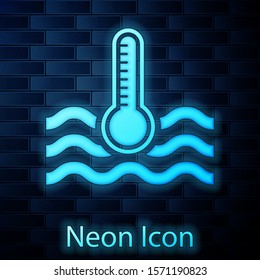 Glowing neon Water thermometer measuring heat and cold icon isolated on brick wall background. Thermometer equipment showing hot or cold weather.  Vector Illustration