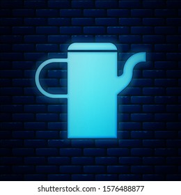 Glowing neon Watering can icon isolated on brick wall background. Irrigation symbol.  Vector Illustration