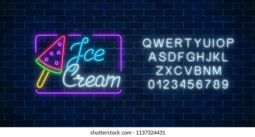 Glowing neon watermelon ice cream cafe signboard with alphabet on dark brick wall background. Ice-cream lolly. City neon advertising street sign. Vector illustration.