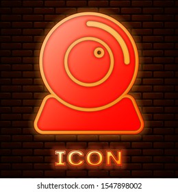 Glowing neon Web camera icon isolated on brick wall background. Chat camera. Webcam icon.  Vector Illustration