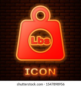 Glowing neon Weight pounds icon isolated on brick wall background. Pounds weight block for weight lifting and scale. Mass symbol.  Vector Illustration