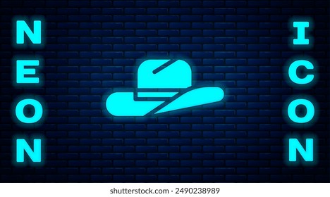 Glowing neon Western cowboy hat icon isolated on brick wall background.  Vector Illustration