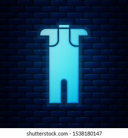 Glowing neon Wetsuit for scuba diving icon isolated on brick wall background. Diving underwater equipment.  Vector Illustration