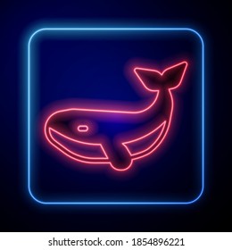Glowing neon Whale icon isolated on blue background.  Vector