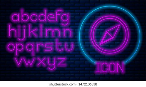 Glowing neon Wind rose icon isolated on brick wall background. Compass icon for travel. Navigation design. Neon light alphabet. Vector Illustration