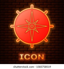 Glowing neon Wind rose icon isolated on brick wall background. Compass icon for travel. Navigation design.  Vector Illustration