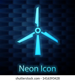 Glowing neon Wind turbine icon isolated on brick wall background. Wind generator sign. Windmill silhouette. Windmill for electric power production. Vector Illustration