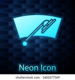 Glowing neon Windscreen wiper icon isolated on brick wall background.  Vector Illustration