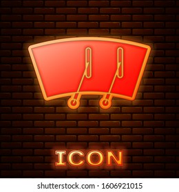 Glowing neon Windscreen wiper icon isolated on brick wall background.  Vector Illustration