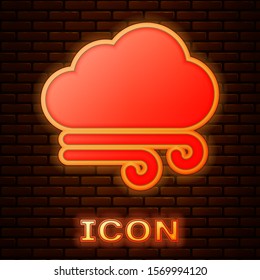 Glowing neon Windy weather icon isolated on brick wall background. Cloud and wind.  Vector Illustration