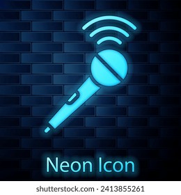 Glowing neon Wireless microphone icon isolated on brick wall background. On air radio mic microphone. Speaker sign.  Vector