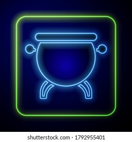 Glowing neon Witch cauldron icon isolated on blue background. Happy Halloween party.  Vector Illustration