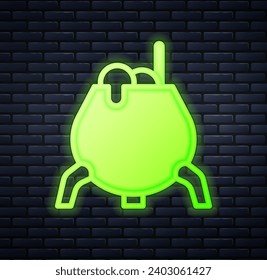 Glowing neon Witch cauldron icon isolated on brick wall background. Happy Halloween party.  Vector