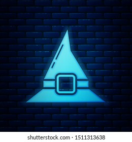 Glowing neon Witch hat icon isolated on brick wall background. Happy Halloween party.  Vector Illustration