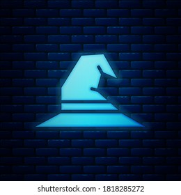 Glowing neon Witch hat icon isolated on brick wall background. Happy Halloween party.  Vector Illustration