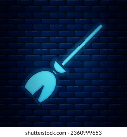 Glowing neon Witches broom icon isolated on brick wall background. Happy Halloween party.  Vector Illustration