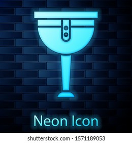 Glowing neon Wooden pirate leg icon isolated on brick wall background.  Vector Illustration