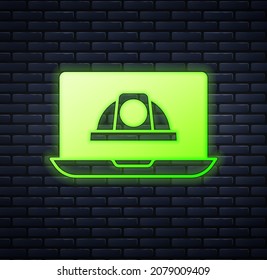 Glowing neon Worker safety helmet icon isolated on brick wall background.  Vector