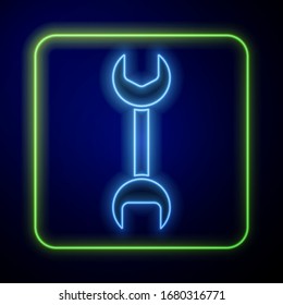 Glowing neon Wrench spanner icon isolated on blue background.  Vector Illustration