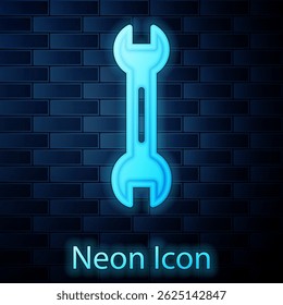 Glowing neon Wrench spanner icon isolated on brick wall background.  Vector