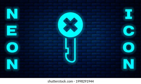 Glowing neon Wrong key icon isolated on brick wall background.  Vector Illustration