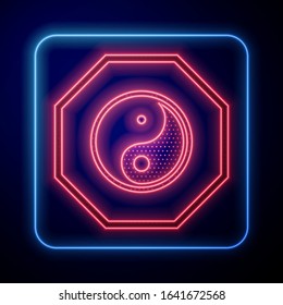 Glowing neon Yin Yang symbol of harmony and balance icon isolated on blue background.  Vector Illustration