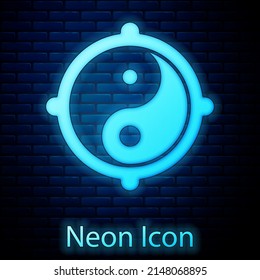Glowing neon Yin Yang symbol of harmony and balance icon isolated on brick wall background. Vector