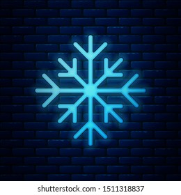 Glowing neonSnowflake icon isolated on brick wall background.  Vector Illustration