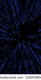 Glowing particles, polka dots on a dark blue background. Vertical festive banner. An elegant holiday pattern. Vector illustration.