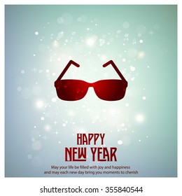 Glowing red typography with Glasses Icon on blue background - 2016 Happy New Year Greeting Card Design - Colorful Background