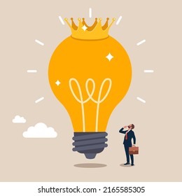 Glowing shiny lightbulb idea lamp wearing golden crown. Great and brilliant idea, creative genius or winner idea for business development.