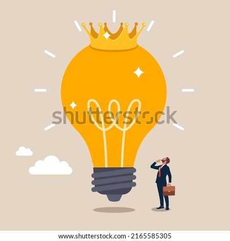 Glowing shiny lightbulb idea lamp wearing golden crown. Great and brilliant idea, creative genius or winner idea for business development.