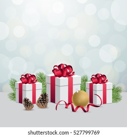Glowing silver bokeh background and christmas gift boxes with decorations