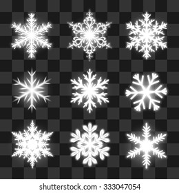 Glowing snowflakes on the transparent background. Vector Eps10.