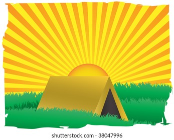 Glowing sun rise over camping tent inside grassy field