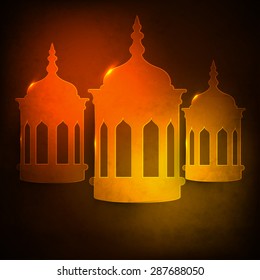 Glowing traditional lanterns on grungy brown background for Islamic holy month of prayers, Ramadan Kareem celebration.