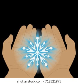 glowing transparent snowflake in hands on a black background. palms stretch a snowflake