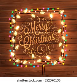 Glowing White Christmas Lights Wreath for Xmas Holiday Greeting Cards Design. Wooden Hand Drawn Background.