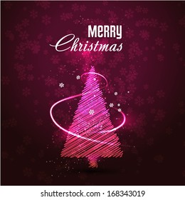 Glowing xmas tree on dark background
