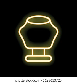 Glowing yellow neon sign of a classic female mannequin torso for dressmaking on a black background