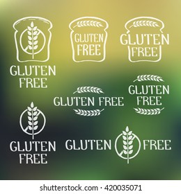 Gluten free- handdrawn isolated logo elements on blurred backdrop. Unique design for ads, signboards, packaging and identity and web sites. Logotypes created with rough effect. Vector illustration.