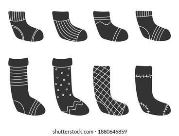 Glyph template Christmas sock set. Warm cozy winter clothes. Traditional retro xmas striped stocking. Hygge time, holiday cute accessory. Silhouette black hosiery Isolated on white vector illustration