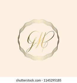 GM elegant monogram in a wire frame.Golden calligraphic logo isolated on a pale rose background.Initial based decorative vector icon.Luxury wedding style.